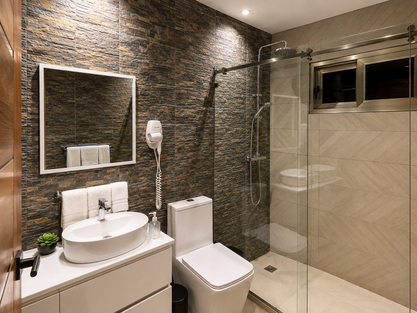 Modern bathroom with stone wall and glass rain shower
